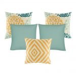 A collection of 5 square cushion covers with floral, chevron and solid patterns with duck egg and orange colours