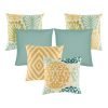 A collection of 6 square cushion covers with floral, chevron and solid patterns with duck egg, olive and orange colours