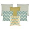 A set of 6 cushions in gold and teal colours with chevron and solid patterns