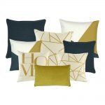 A set of 8 dark blue, gold and white cushions covers with linear pattern and home print