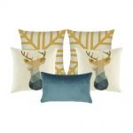 Photo of five cushion covers in gold, white and blue colours with moose design