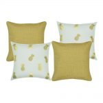 A collection of 4 square cushions in gold and white colours with solid and pineapple patterns
