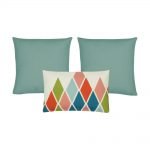 A set of 3 rectangular and square cushions in duck egg colour and diamond patterns