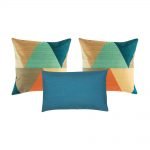 A set of 3 square and rectangular blue cushions with triangle patterns