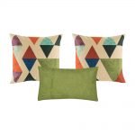 A set of 3 cushions with solid green colour and diamond patterns