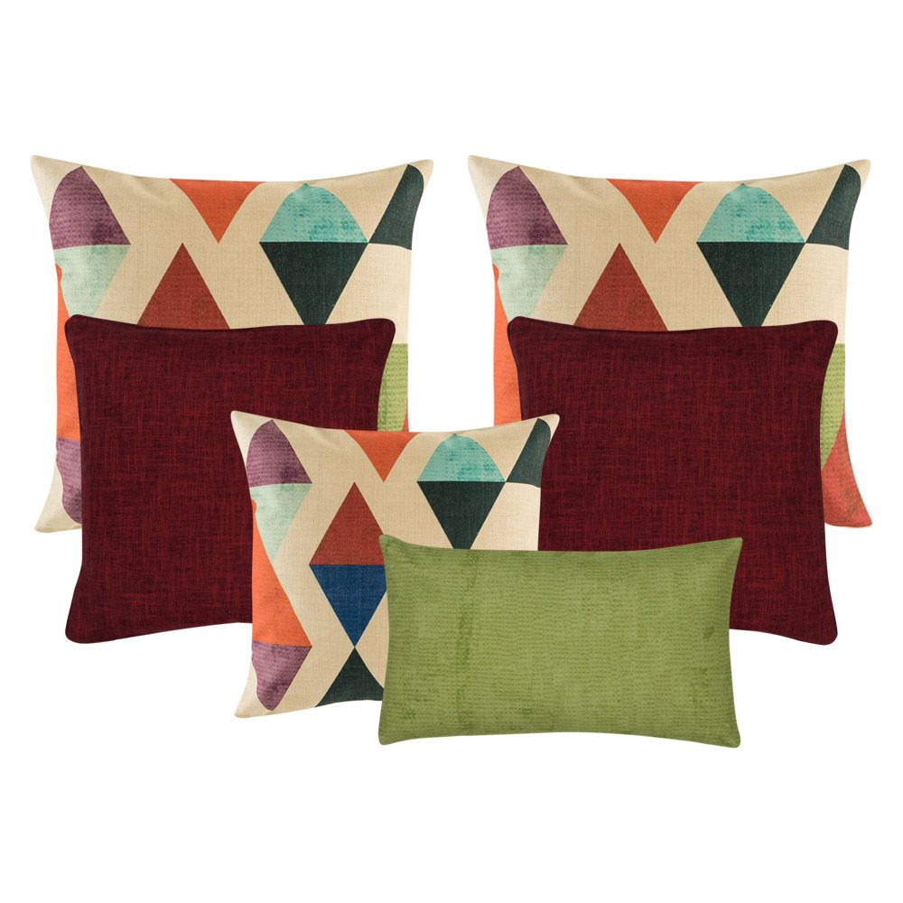 A collection of red, green and multi-colored cushions with diamond and triangle patterns