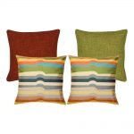 A collection of 4 multi-coloured, burnt orange and olive square cushions