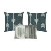 A photo of three cushion covers with arrow and stripes design, in white and grey colours