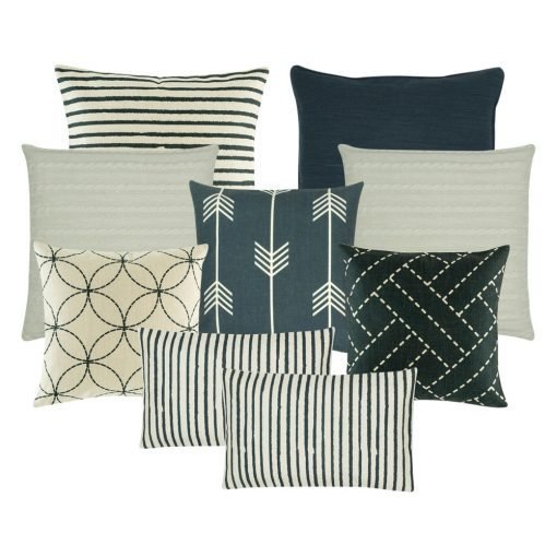A collection of 9 black, white, navy cushions in stripes, circle, line patterns