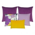 A mix of5 cushion covers in purple, lavender and yellow colours and floral and chevron designs