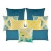 A mix of square and rectangular cushions with blue and yellow colours and diamond and zigzag patterns
