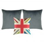 A collection of 3 square cushions with grey and fuschia colours and cross design