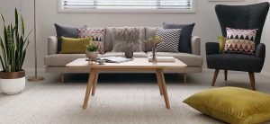 Living room styled in Mid century modern decor with mustard and fur cushions