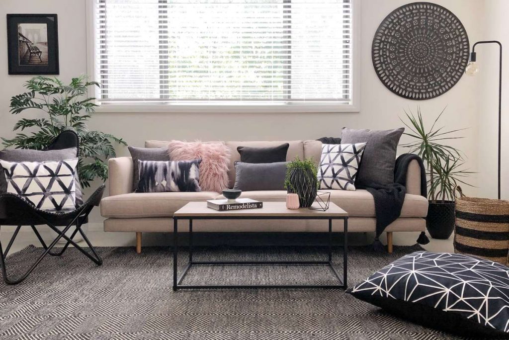 Living room with Urban modern styling with pink and grey cushions