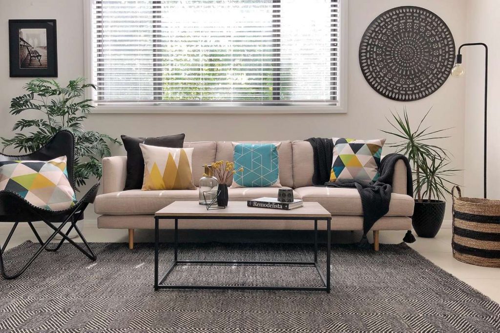 Urban modern styled living room with funky cushion and a large grey floor cushion