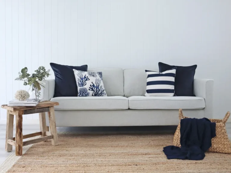 Scene demonstrating how to choose cushions with navy designs on a grey sofa.