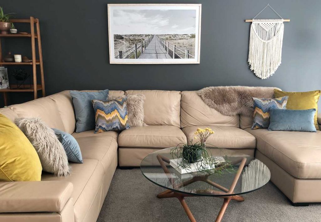 Corner sofa with mustard and light blue cushions