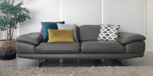 Grey sofa and a 3-1 cushion arrangement with cushions in teal and mustard