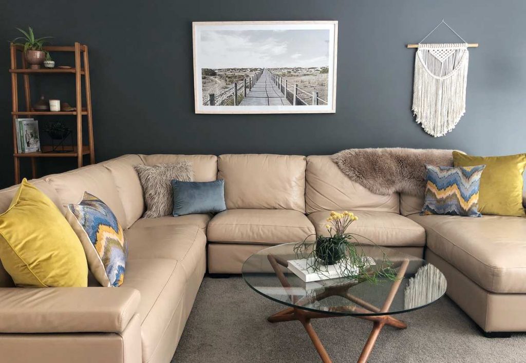 Lounge room scene with beautiful mustard and blue cushions