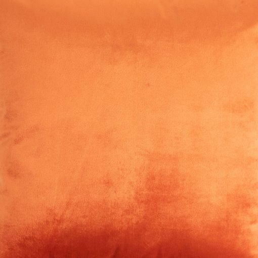 Close up image of velvet linen cushion cover in burnt orange colour