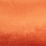 Close up photo of burnt orange rectangular cushion made of velvet fabric