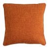 Photo of square rust orange cushion cover made of polyester fabric