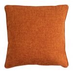 Photo of square rust orange cushion cover made of polyester fabric