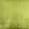 Close up image of velvet cushion in olive green colour