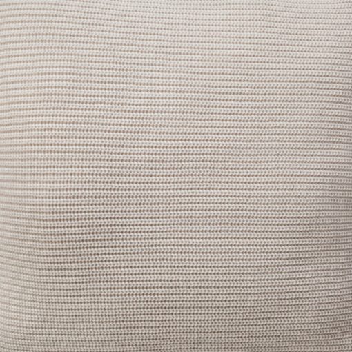 Close up photo of alabaster white knit cushion cover with tassels