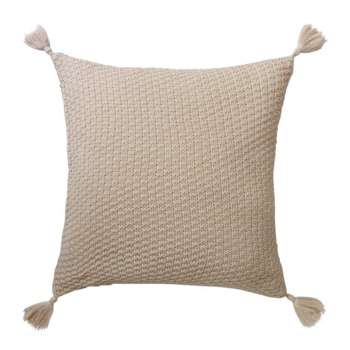 Close up photo of beige knit cushion cover with tassels