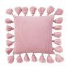 Photo of pink knit cushion with tassels