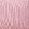 Close up image of pink cushion cover made of knit fabric