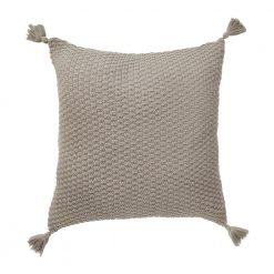 Image of pale brown knitted cushion with tassels