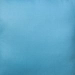 Close up photo of cornflower blue cushion cover made of outdoor cotton fabric