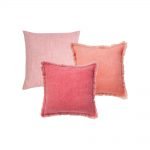 Photo of red and blush coloured square cushion covers in set of 3