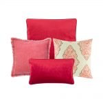Photo of a collection of 4 red cushion covers in square and rectangular shapes