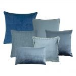 Photo of blue coloured cushions in velvet and cotton linen fabric