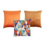 Photo of copper coloured 3 cushion covers in velvet and cotton linen fabric