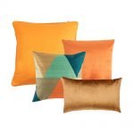 Photo of square and rectangular cushions in shades of orange colour