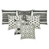 Image of 7 tribal inspired black and white outdoor cushions made of UV and water resistant fabric