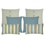 A collection of blue and white cushion covers in solid and line patterns