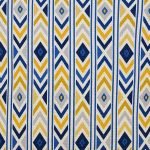 Close up image of bright and bold coloured cushion cover with yellow and blue arrows