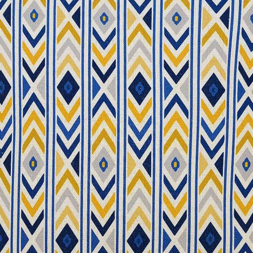 Close up image of bright and bold coloured cushion cover with yellow and blue arrows