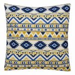 Photo of white cushion cover with blue and yellow tribal zigzag patterns