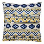 Photo of white cushion cover with blue and yellow tribal zigzag patterns