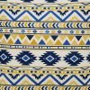 Close up photo of zigzag patterned cushion cover in bright yellow and blue colours