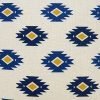 Close up image of Aztec inspired off-white cushion cover in 45cm x 45cm size