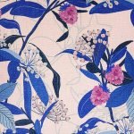 Close up image of pink cotton linen cushion cover with blue leaves