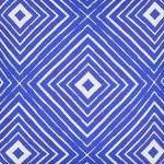 Close up image of blue outdoor cushion in kaleidoscope design