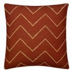 Photo of burgundy mud cloth cushion cover with chevron design